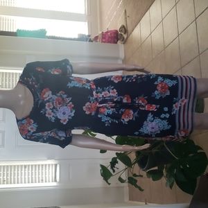 Signature Studio s artsy floral display laser cutout arms and scoop hems